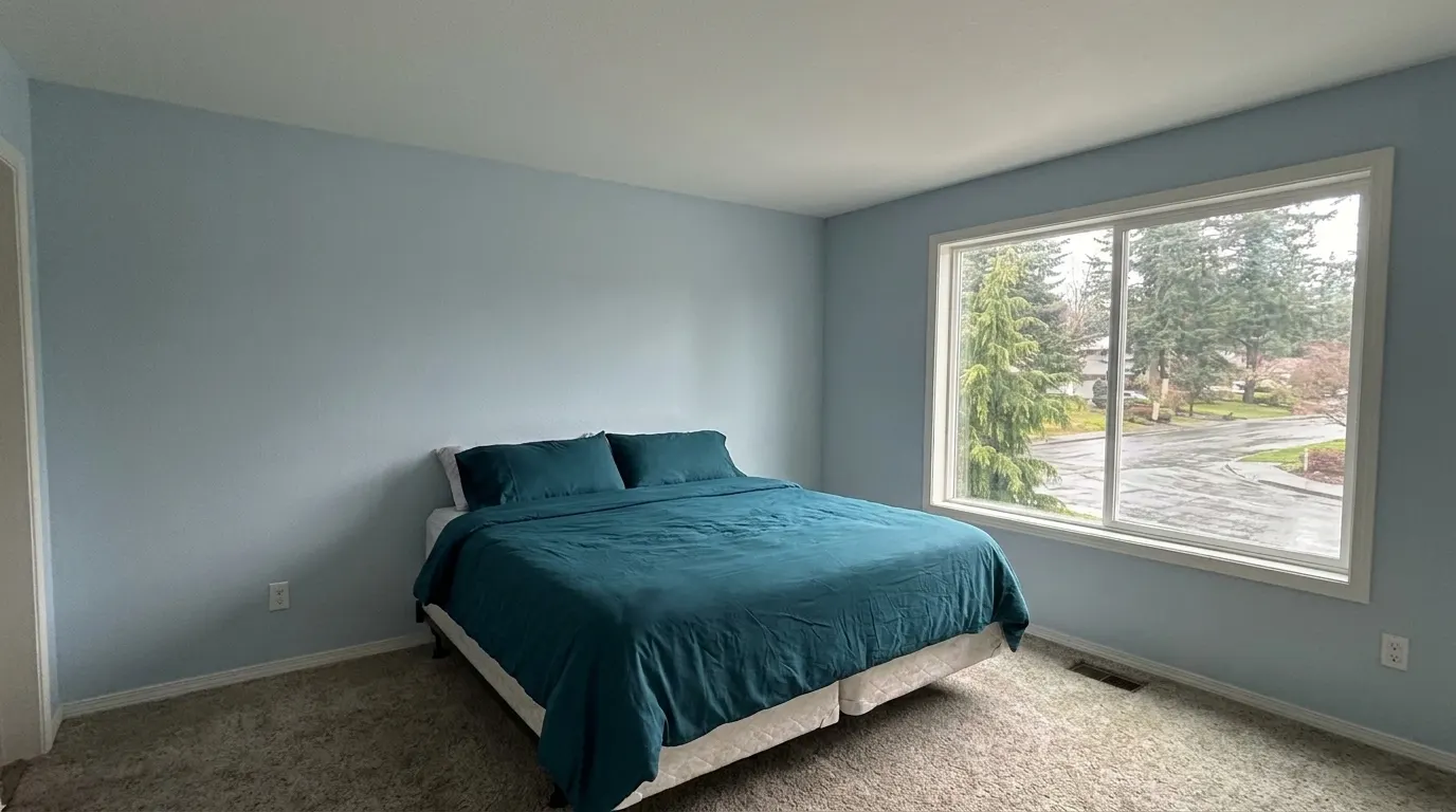 Same bedroom with rebuilt ceiling after storm damage restoration